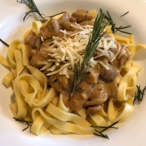 Homemade tagliatelle with mushrooms, rosemary  and vegan cheese at Verde in Basel