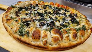 Spinach,  Artichoke,  and Black Olives, on Vegan Garlic Knot Crust at Pasquale's Pizzeria III in Middletown