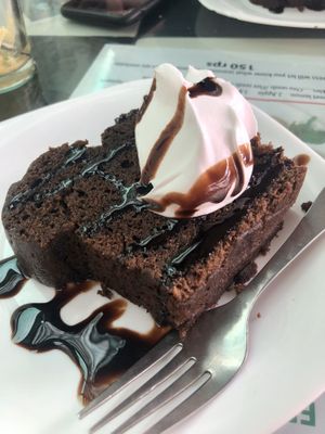 Chocolate cake with vegan cream! at Aum Cafe in Varanasi