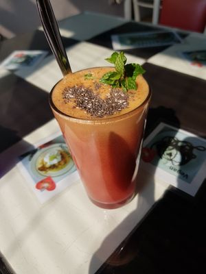orange, apple, carrot, spinach and chia seeds juice at Aum Cafe in Varanasi
