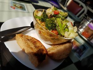vegan prima vera pasta with veggies, garlic, herbs, olive oil and bread at Aum Cafe in Varanasi