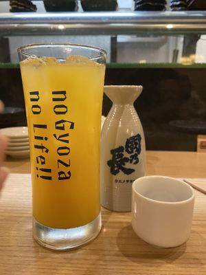Orange juice and Sake  at Gyozaoh Dotonbori in Osaka