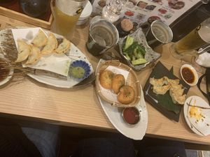 Pan and deep fried veggie gyoza, cheese potatoes and cucumbers with sesame oil/ seeds  at Gyozaoh Dotonbori in Osaka