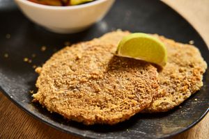 Vegan Corn Schnitzel - Mixture of corn and kidney beans flavoured with lime in a homemade, vegan breading, finely baked at HeimWerk Altstadt in Dusseldorf