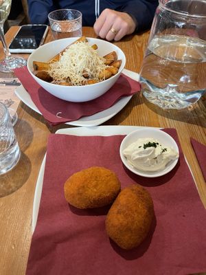 Supplì (rice balls) and Chips Cacio & Pepe  at Sora Lella Roman Vegan Restaurant in Edinburgh