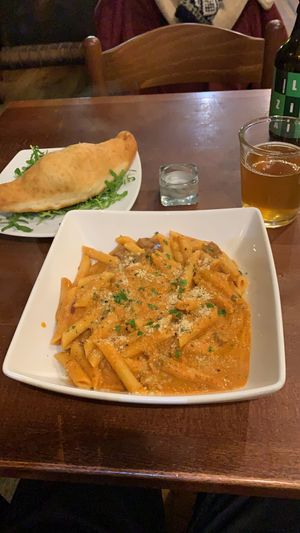Penne alla Vodka and a calzone on the side  at Sora Lella Roman Vegan Restaurant in Edinburgh