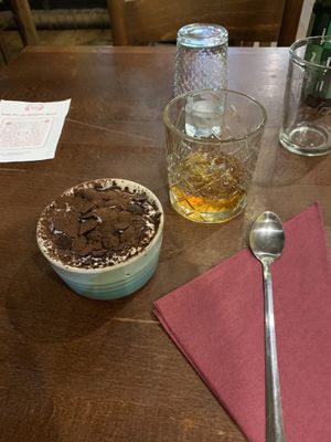 Vegan tiramisu and a glass of whiskey and amaretto  at Sora Lella Roman Vegan Restaurant in Edinburgh