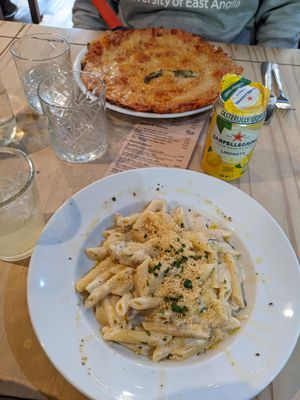 Quattro formaggi pasta and Margherita pizza in the back at Sora Lella Roman Vegan Restaurant in Edinburgh