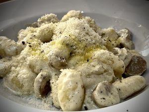 Gnocchi with truffle cream and sausage  at Sora Lella Roman Vegan Restaurant in Edinburgh