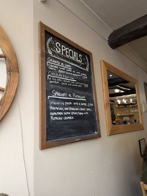 Specials of the day, including my meal and the desserts. at Sora Lella Roman Vegan Restaurant in Edinburgh