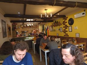 The warm, inviting interior of the restaurant at Sora Lella Roman Vegan Restaurant in Edinburgh