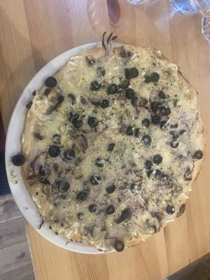 Quattro formaggi con funghi with red onions and black olives   at Sora Lella Roman Vegan Restaurant in Edinburgh