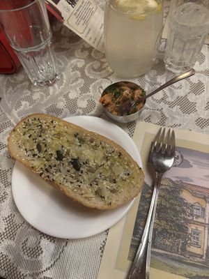 Amuse-bouche consisting of a toasted baguette with nut-seed-mix and a mustard based vegetable dip  at Marchfelderhof in Deutsch-wagram