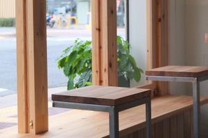 Wooden bench and table.  at ANY B&B + Coffee in Nara