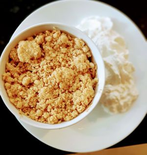 Vegan apple and raspberry crumble with coconut whipped cream 👍 at Gopal - temporarily closed in Tours