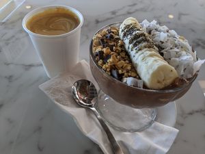 Chocofrost Smoothie Bowl with an oat latte from a neighboring place at Nice Sprout in Houston