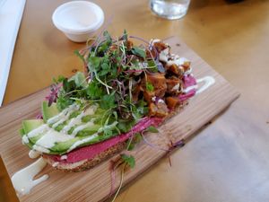 Beet hummus, potato, avocado toast. at Nice Sprout in Houston