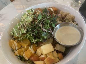Great bowl: Spring greens, Quinoa, tahini sweet potatoes, avocado, apple, oranges, cashew dressing, fruit and nut mix! at Nice Sprout in Houston