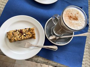 Vegan flapjack and chai latte  at Al-Gharb Coffee Roasters in Albufeira