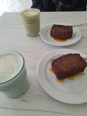 Turmeric latte and blue latte with date cakes at Al-Gharb Coffee Roasters in Albufeira