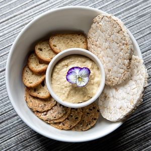 A savoury spread, served with crackers, baguette and rice crackers. at Spa Eastman Restaurant in Eastman