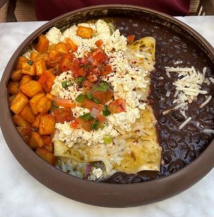 Vegan Breakfast Enchiladas Suiza Style with Black Beans and Papas.   at Toca Madera in Scottsdale