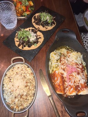 Street corn on the bottom left, mushroom enchiladas on the bottom right, and truffle mushroom tacos on the top. I got the very top right behind the water glass   at Toca Madera in Scottsdale