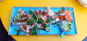 Quesadilla z dipem z awokado i kiszonymi warzywami at Zjesc in Warsaw