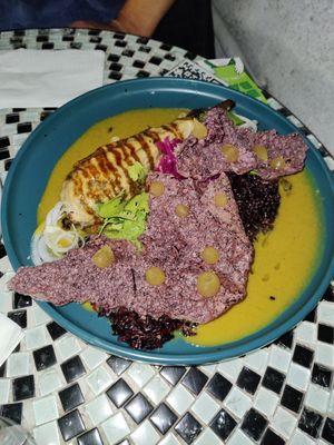 Aubergine with black rice under chips with mango gel at Violeta in Santiago