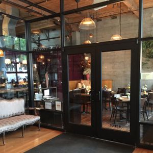 In and to the RIGHT!! (Suite B) Turning left upon entry to the building takes you to La Spiga, a different restaurant and a mistake we made on our first visit! at Plum Bistro in Seattle