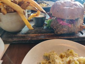 Crispy chick'n burger and fries at Plum Bistro in Seattle