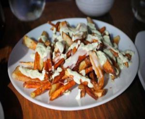 gourmet garlic fries with jalapeno sauce at Plum Bistro in Seattle