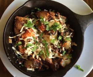 country yams and breakfast potatoes with daiya cheese  at Plum Bistro in Seattle