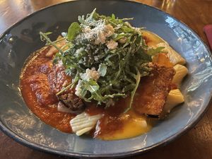 Perfectly thin Crispy eggplant parm on a bed of creamy Alfredo pasta and when that marinara and Alfredo blends it’s divine ! #Veganuary at Plum Bistro in Seattle