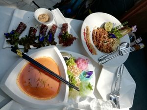 Fresh spring rolls, mushroom pad thai, red curry and chai with home made nut milk  at The Living Library in Vientiane