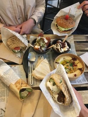 Pita falafel, wrap falafel, burger falafel. Halloumi, falafel fries et houmous. Le tout pour 41€.   at Maha in Brussels