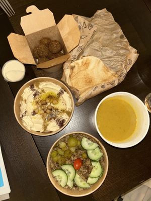 Falafel,soup,tahin sauce,bread,hummuss  at Maha in Brussels