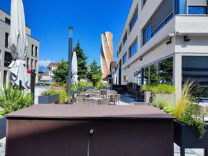 Outdoor seating in the back at Scanaua in Schaan