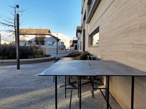 Outdoor seating on back side (closed for winter) at Scanaua in Schaan