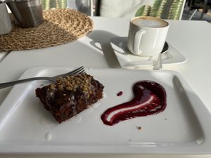 Carrot cake and coffee with almond milk  at Calma Cafe in Gran Canaria