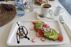 Avocado sandwich and coffee with almond milk at Calma Cafe in Gran Canaria