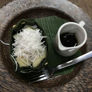 Pisang Rai: boiled banana in rice flour dough served with fresh coconut and coconut palm syrup at Tukies Coconut Shop - Jl. Monkey Forest in Ubud