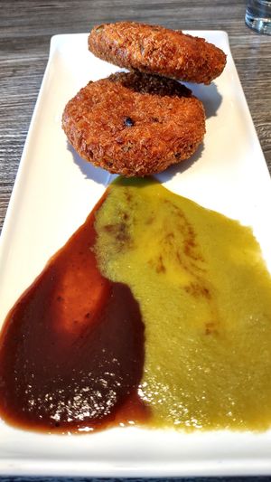 Aloo Tikki (crispy potato cake with mint and tamarind sauces – vegan, $6)  at Zomsa in El Cerrito