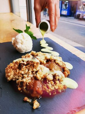 Homemade Apple Crumble with Homemade Custard, served with Vanilla Ice Cream 💛 at Viridian in Bangor