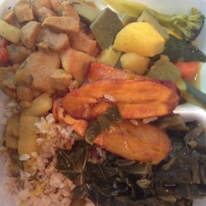 curry veggies and un-goat, plantains, rice and collard greens at Healthful Essence in Atlanta