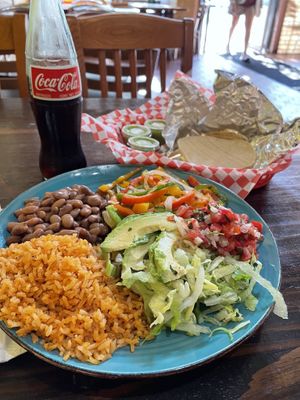Fajitas plate with pinto beans, salsa verde, corn tortillas and a mexican Coke.  at La Cumbre Taqueria in San Francisco