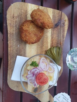 Minced meat patties with potato salad at Bierosophie in Vienna