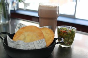 Venezuelan cake stuffed with vegetables and spicy sauce at Lúcuma VZLA in Barcelona