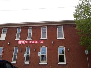 Large parking lot on left side of building.  at Ruby Coffee Roasters in Stevens Point