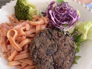 Kids option, rice noodles with sauce and bean burger with salad  at Raiz in Aveiro